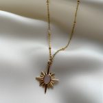 gold sun chain with pinkish stone with delicate chain