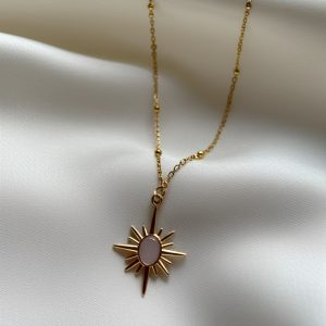 gold sun chain with pinkish stone with delicate chain
